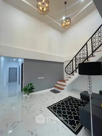 Elegant modern living room with high ceiling and stylish staircase