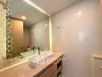 Modern bathroom with elegant vanity and large mirror
