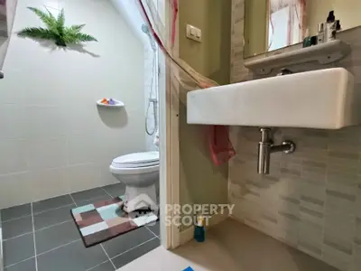 Modern bathroom with sleek fixtures and stylish tile design