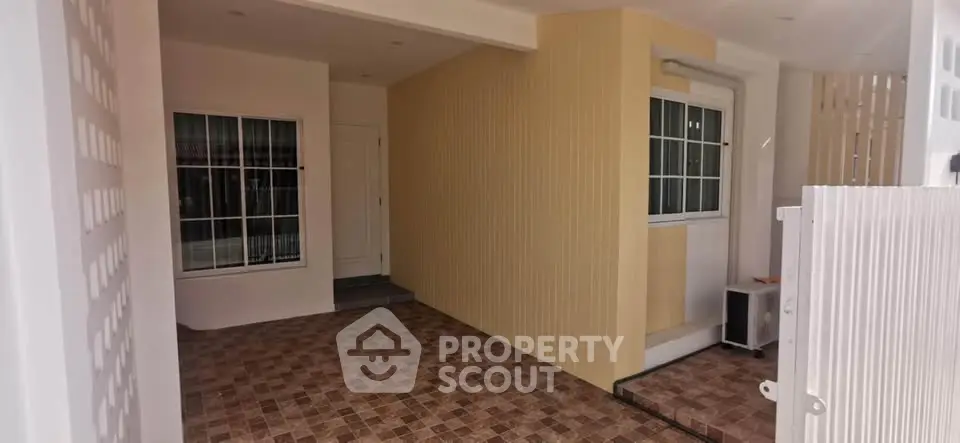 Charming entrance with tiled flooring and modern design
