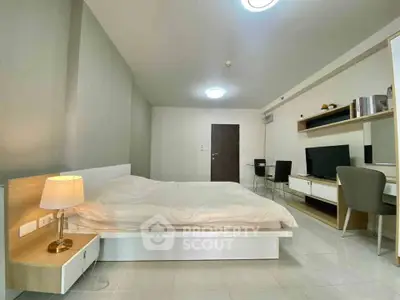 Modern bedroom with sleek furniture and ambient lighting