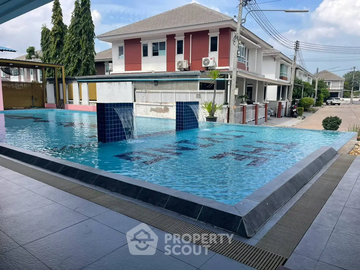 Modern residential complex with a stylish outdoor pool and contemporary architecture.