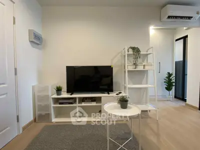 Modern living room with sleek furniture and air conditioning, perfect for cozy gatherings.