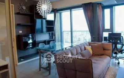 Modern living room with stylish decor and large windows offering a stunning view.