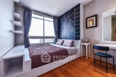Modern bedroom with geometric accent wall and large window