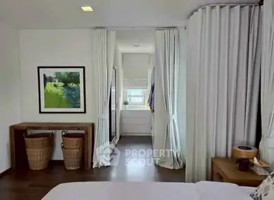 Elegant bedroom with natural light and stylish decor