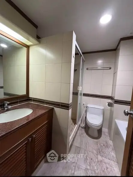 Modern bathroom with elegant tile design and sleek fixtures