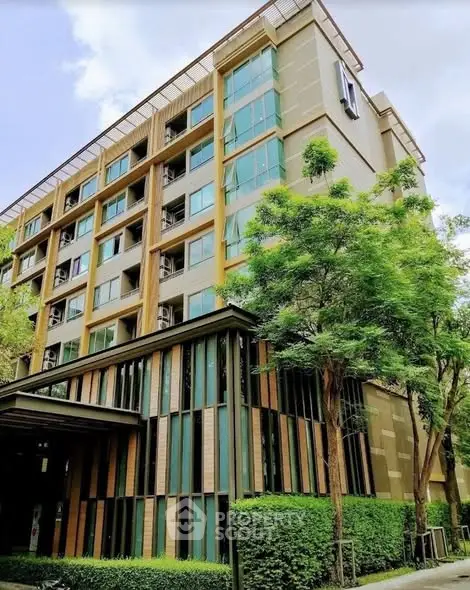 Modern apartment building with lush greenery and contemporary design