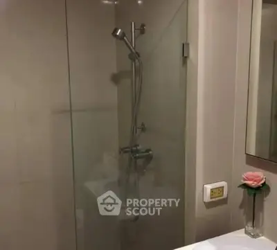 Modern bathroom with glass shower and elegant fixtures