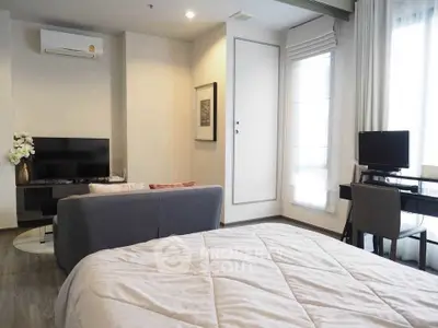 Modern studio apartment with cozy living area and stylish decor