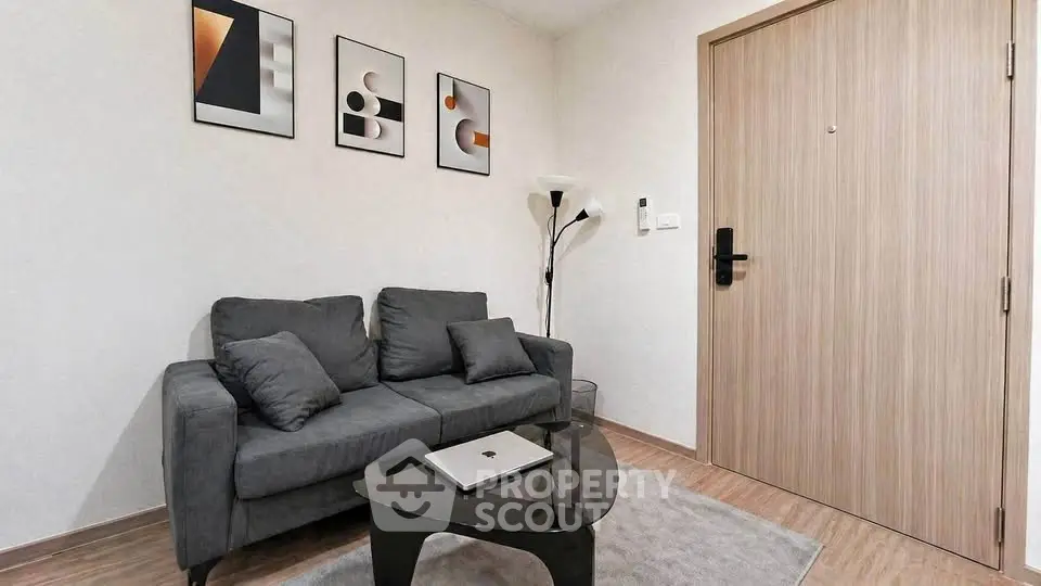 Modern living room with stylish decor and comfortable seating in a cozy apartment.