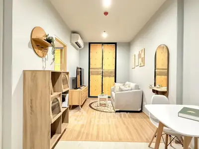 Modern living room with stylish furniture and wooden accents, perfect for cozy living.