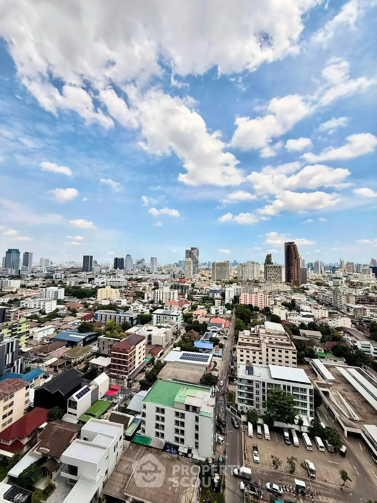 Stunning cityscape view showcasing a vibrant urban skyline under a clear blue sky.