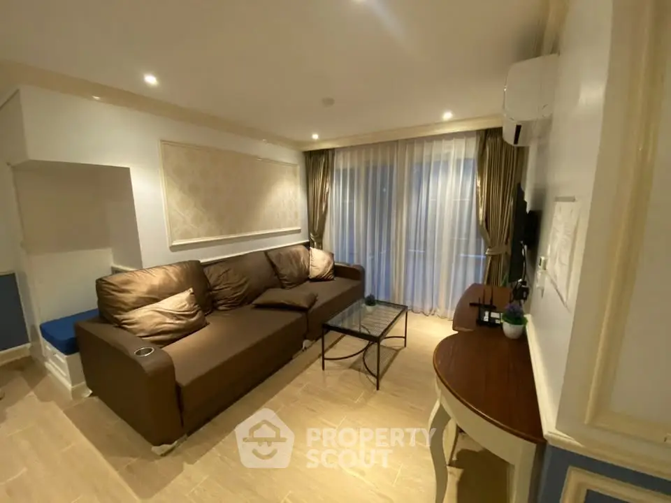 Spacious living room with cozy brown sofa and elegant decor