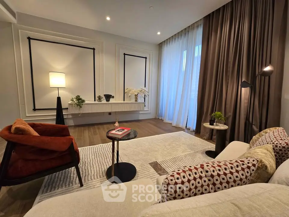 Elegant living room with modern decor, cozy seating, and soft lighting.