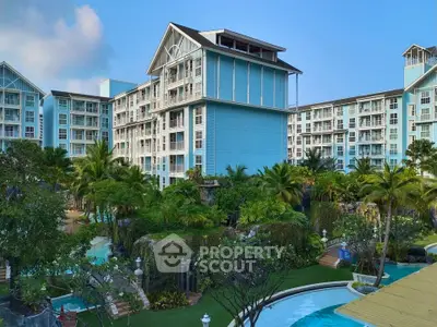 Luxurious resort-style condominium with lush gardens and pool view