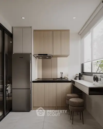 Modern kitchen with sleek design, featuring closed layout and stainless steel appliances.