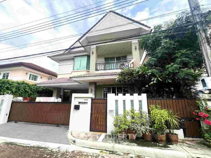 Charming two-story house with lush garden and modern design in a serene neighborhood.