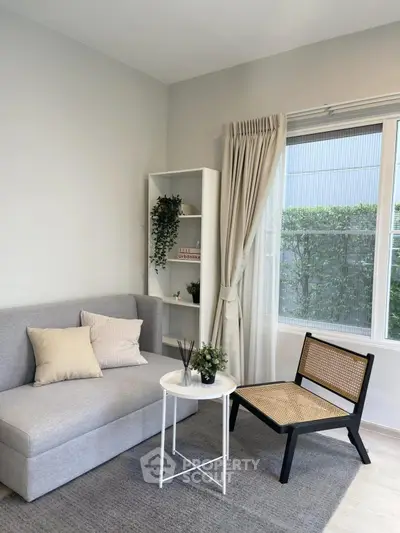 Chic living room with modern furniture and large window view