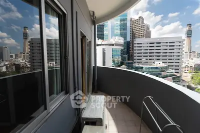 Spacious balcony with stunning cityscape view in modern urban apartment