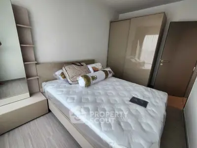 Modern bedroom with sleek design and ample storage space