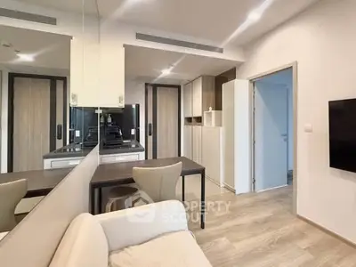 Modern apartment interior with sleek kitchen and cozy dining area