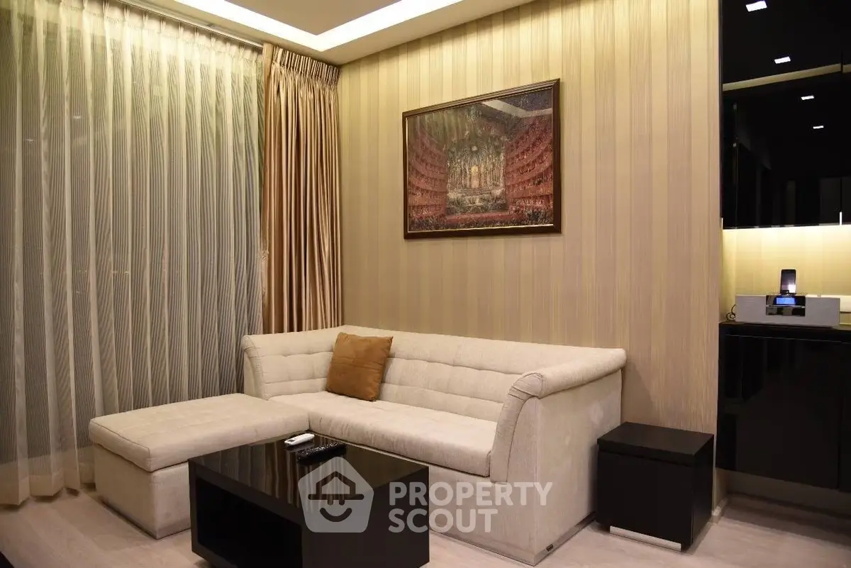Elegant living room with modern sofa, stylish decor, and ambient lighting for a cozy atmosphere.