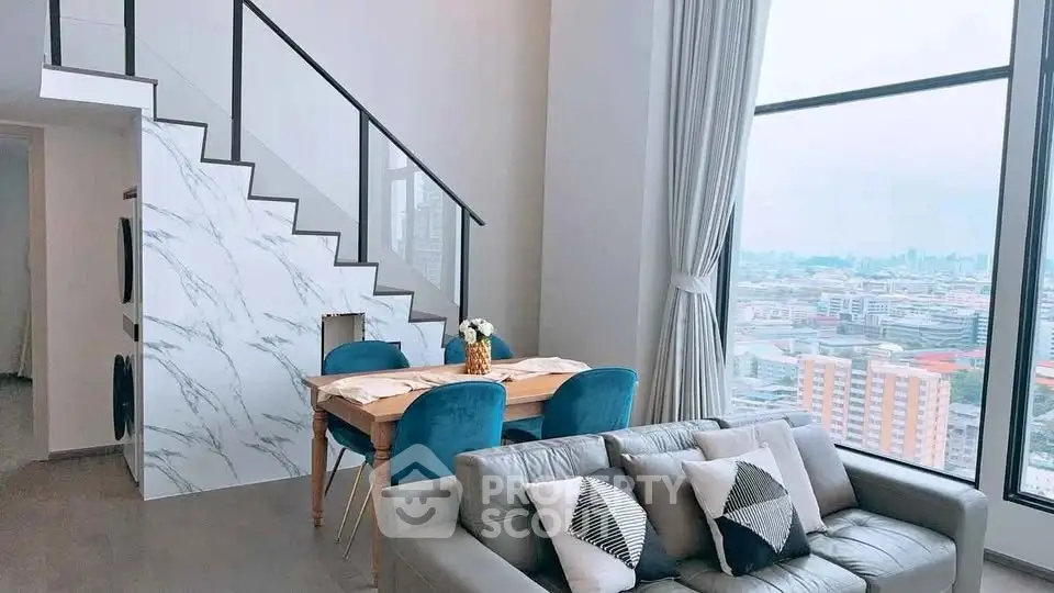 Modern living room with city view, stylish staircase, and elegant dining area.