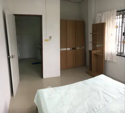 Spacious bedroom with modern wardrobe and natural light