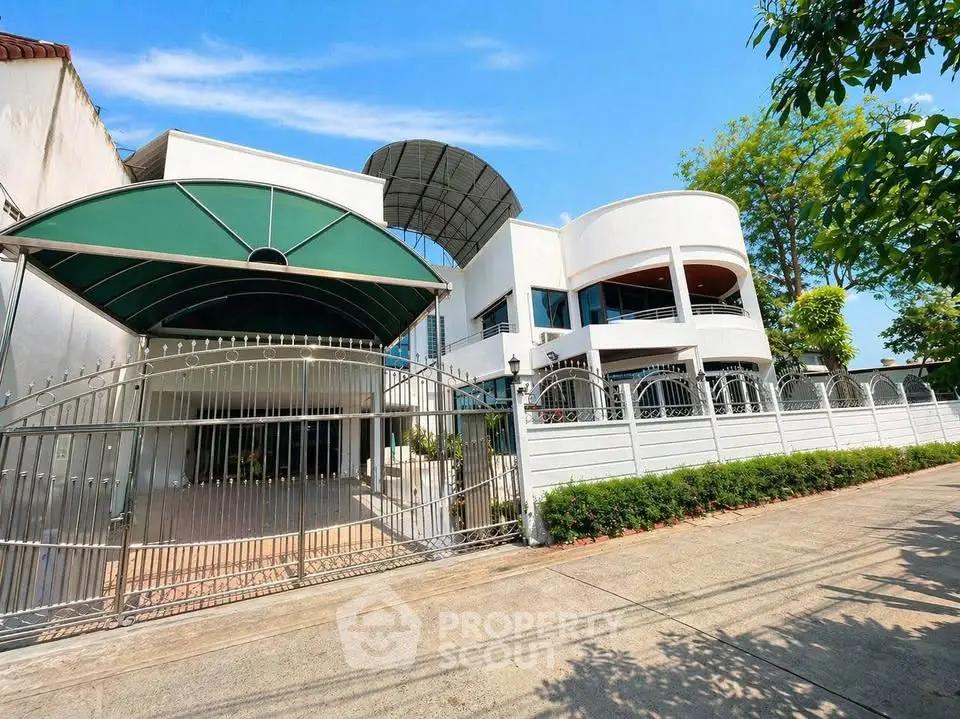 Stunning modern house with unique architecture and gated entrance, perfect for luxury living.