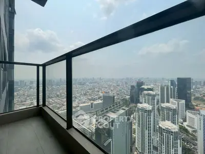 Stunning high-rise balcony with panoramic city skyline view, perfect for urban living enthusiasts.