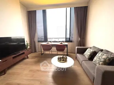 Modern living room with large window and stylish furniture in urban apartment