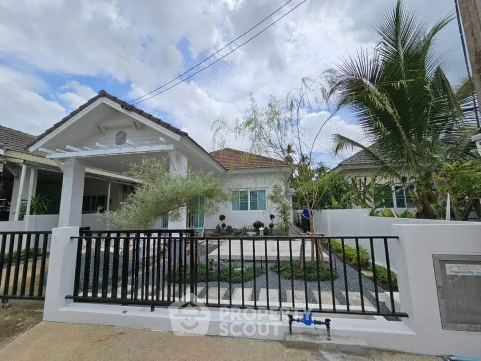 Charming single-story home with lush garden and modern exterior design