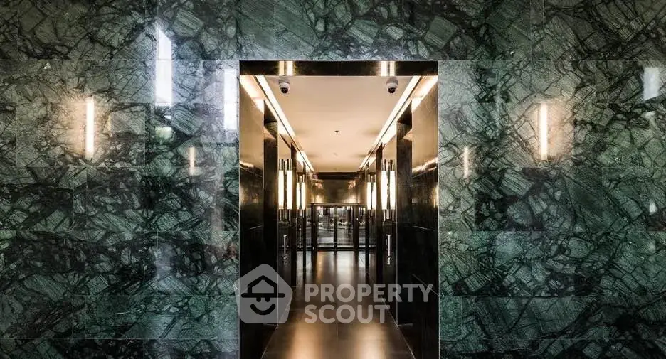 Luxurious marble hallway entrance with modern lighting in upscale building