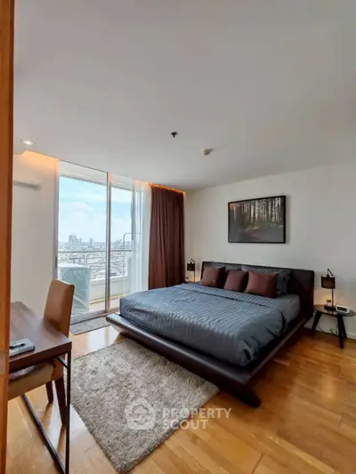 Modern bedroom with city view and stylish decor