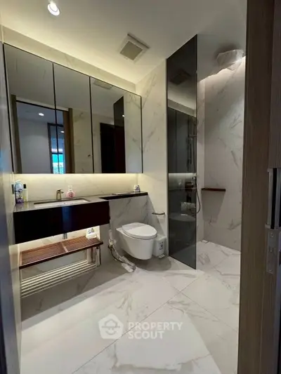 Luxurious modern bathroom with marble tiles and sleek fixtures