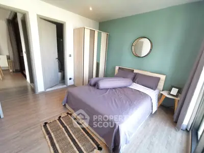 Modern bedroom with stylish decor and natural light