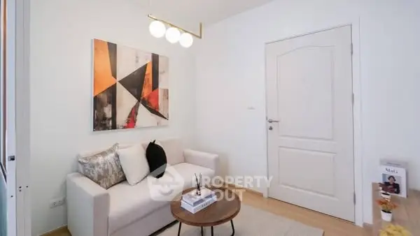 Chic small living room with modern art and cozy seating