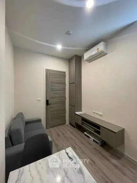 Modern living room with sleek furniture and air conditioning