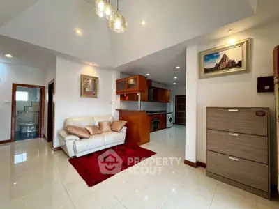 Spacious living room with modern kitchen and elegant decor