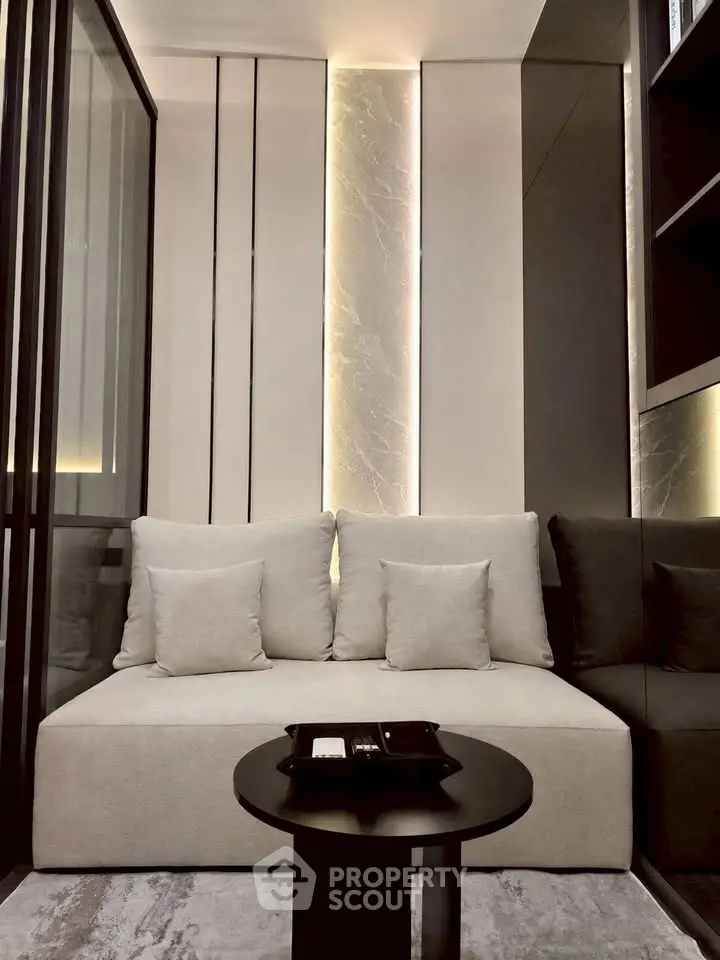 Modern living room with sleek design and cozy seating area