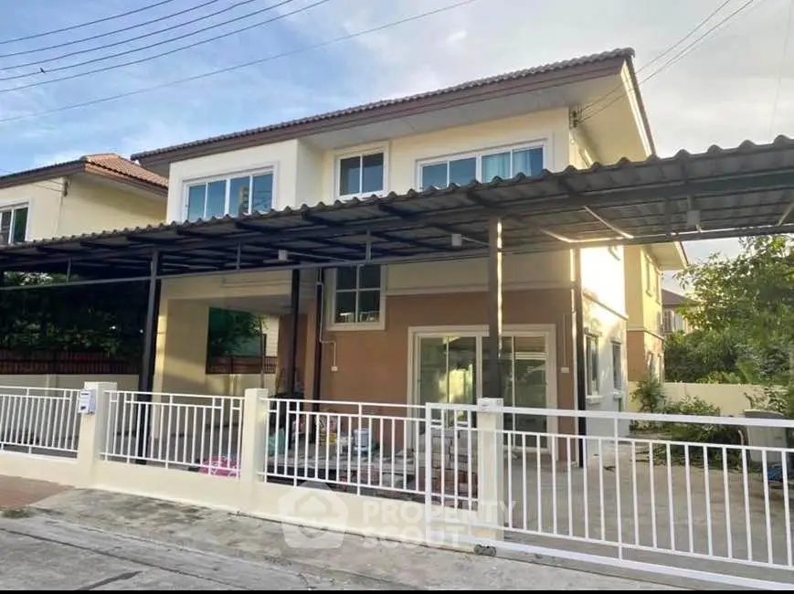 Charming two-story house with modern design and spacious driveway in a serene neighborhood.