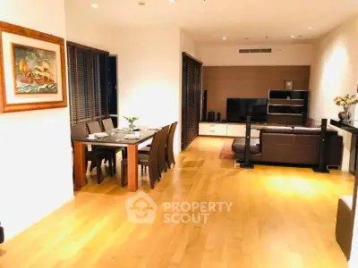 Spacious modern living room with dining area and elegant wooden flooring