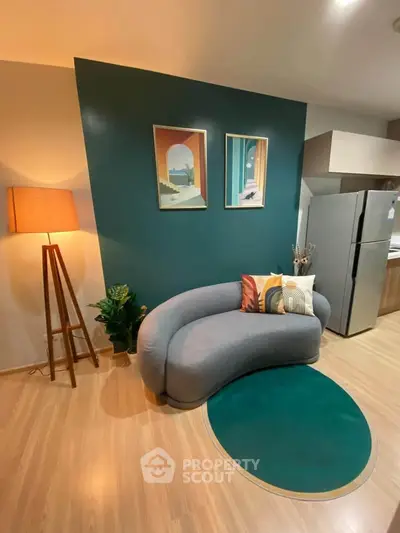 Stylish modern living room with unique curved sofa and vibrant decor, perfect for urban living.