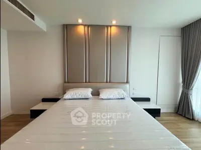 Spacious modern bedroom with elegant design and natural light