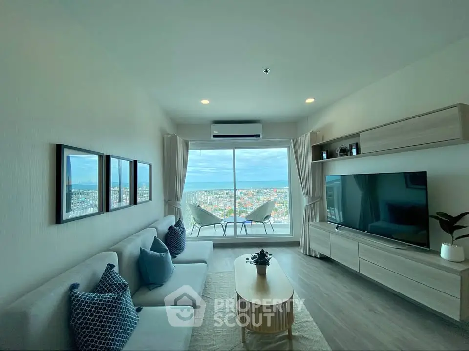 Modern living room with panoramic city view and stylish decor