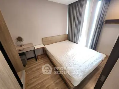 Modern bedroom with minimalist design, featuring a cozy bed and stylish decor.