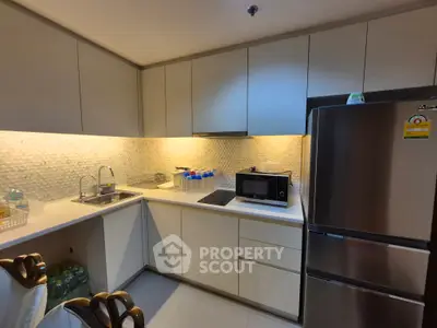 Modern kitchen with sleek cabinetry and stainless steel appliances