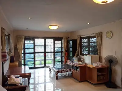 Spacious living room with large windows and natural light