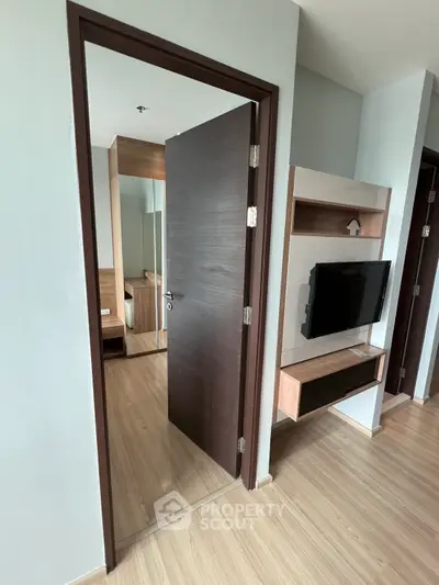 Modern apartment interior with wooden flooring and sleek furniture design